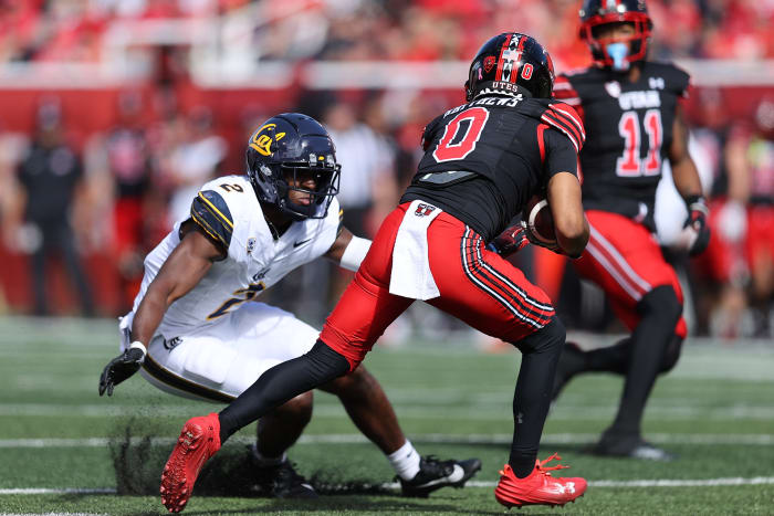 Oct 14, 2023; Salt Lake City, Utah, USA; California Golden Bears defensive back Craig Woodson (2) tackles Utah Utes wide receiver Mikey Matthews (0) in the second quarter at Rice-Eccles Stadium. Mandatory Credit: Rob Gray-USA TODAY Sports